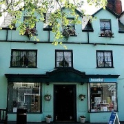 Hairdressers at Bridport Dorset, a charming turquoise building in the square