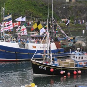 Bunting decorates the boats in Mevagissey Harbour, Cornwall
