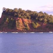Rowers entering harbour past The Ness