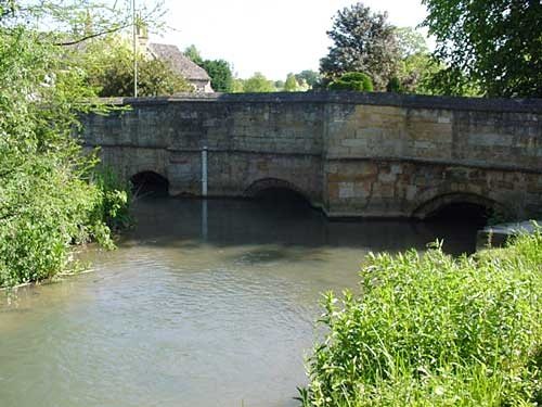 The ancient and picturesque bridge over the river Windrush, in the town of Burford, Oxfordshire