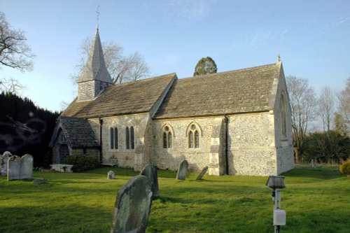 Woodmancote Church with what appears to be a ghost