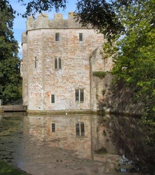 Reflection of the Gatehouse in the moat. The Bishops Palace, Wells.