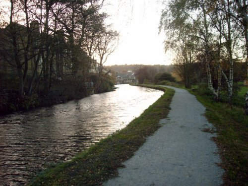 The village of Rodley can be seen in the distance as the Leeds and Liverpool canal approaches