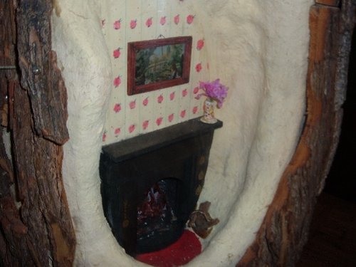 Little model of a fire place inside the Environmental Discovery Centre
