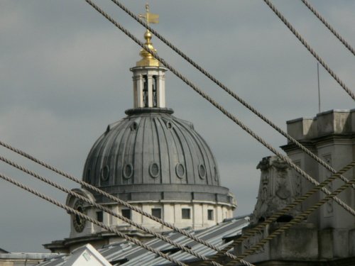 A dome of The Royal Naval College from behind Cutty Sark