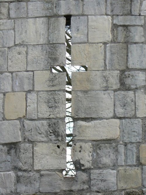 Shoot your arrow through a slit of the Multangular Tower in museum gardens, York.