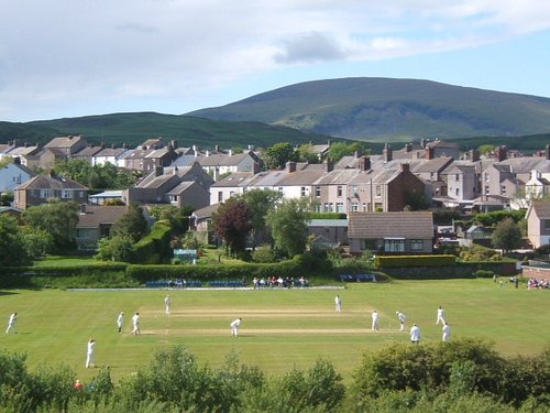 Millom cricket ground, match in progress.