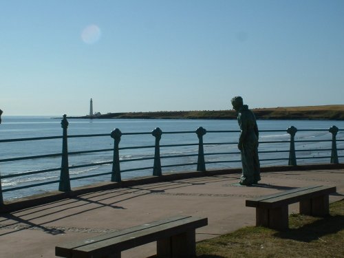 Montrose,The Seafarer sculpture with Scurdie Ness Lighthouse in the background