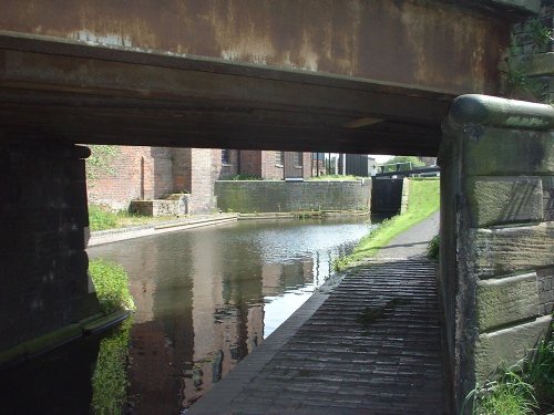Canal in Oldbury, West Midlands, viewed through the Engine Street bridge.