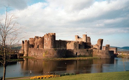 Caerphilly Castle, with daffodils bloomimg in the grounds in the Spring of 2002.