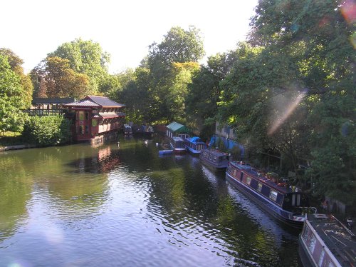 Chinese restaurant and barges moored on the Regents Canal in central London, close to London Zoo.