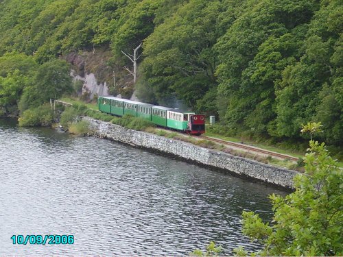 The train going round the lake at Llanberis North Wales this was taken from the boat on the lake.