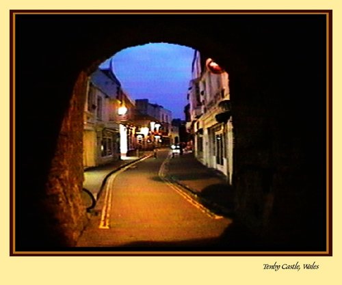 Tenby through castle archway