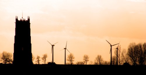 Winterton church tower and Somerton wind turbines in silhouette.