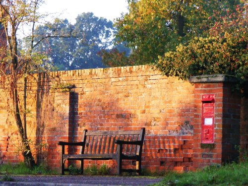 Bench, letter box, dawn.