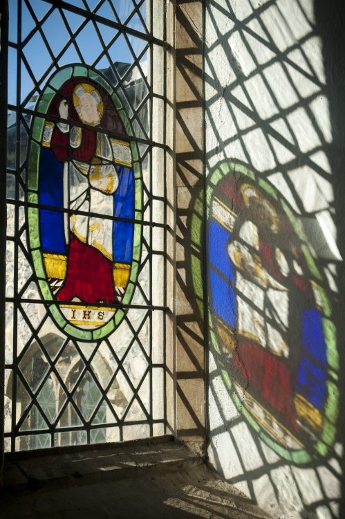 Spring sunlight reflected on the wall of Haddiscoe Church, Norfolk.