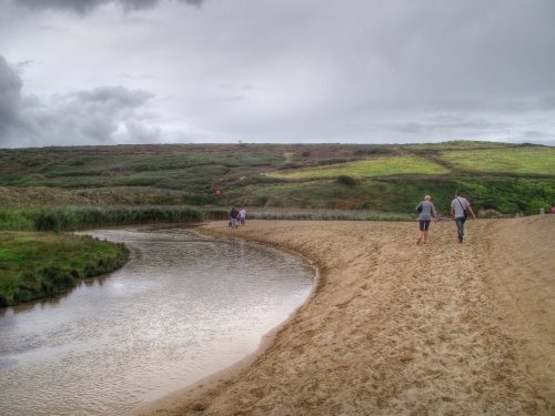 The stream and beach at Holywell bay