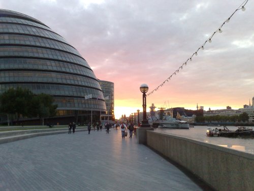The Sun sets behind City Hall