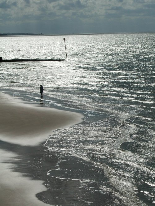 Solo figure on beach