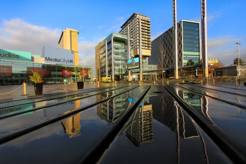 Media City, Salford Quays, a reflection on a picnic bench.