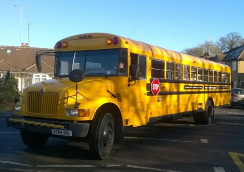 the big yellow bus comes to the school