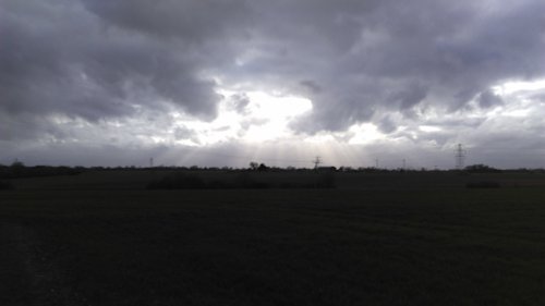 Heavy clouds over Suffolk farm land