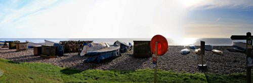 Boats, sun and lifebelt