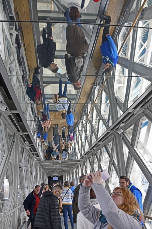 Glass floor reflected in mirrored ceiling