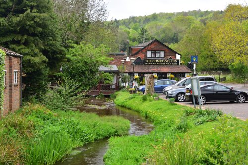The Compasses Inn by the TillingBourne River in Gomshall.