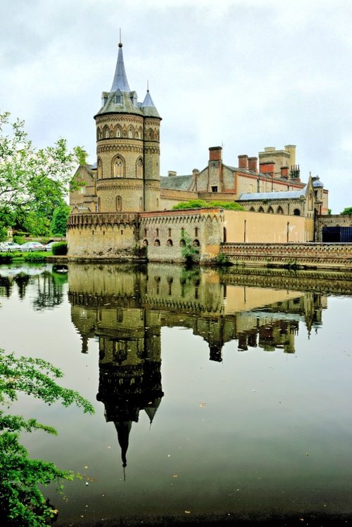 The Gothic Tower Reflecting in the Lake.