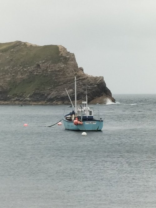 Fishermen's boat on the water at Lulworth Cove