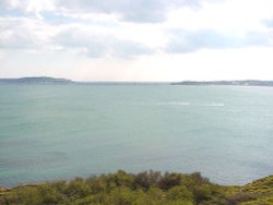 The isle of Portland in the distance to the left Wallpaper