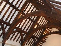 The 'Old Schoolroom' in Chew Magna still has the original 15th century beams Wallpaper