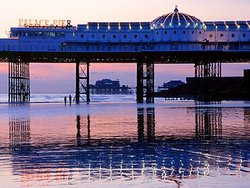 Palace & West Pier at low tide Wallpaper