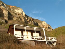 A wintertime shot of a shut up beach house on Branscombe beach, Devon