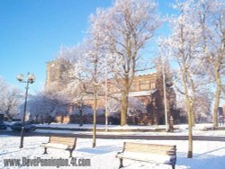 A snow covered Leigh Parish Church Wallpaper