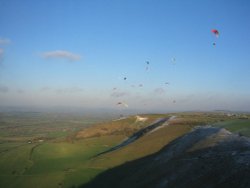Paragliders flying over Westbury White Horse, Wiltshire Wallpaper