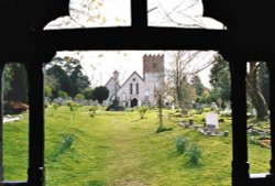 View through the lych gate at All Saints Church, Catherington, Hampshire