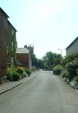 Thrussington street with All Saints Church in the background