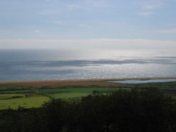 Cloud shadows on the ocean, near Abbotsbury, Dorset, England Wallpaper