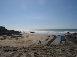 A small bay on the ocean side of the breakwater Wallpaper