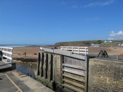 The canal sea lock overlooking summerleaze beach Wallpaper