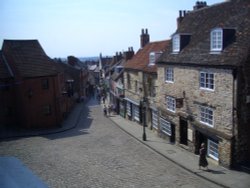 Window view along the bottom of ancient and cobbled Steep Hill, Lincoln. Wallpaper