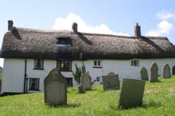 Traditional Devon cottages backing onto churchyard in Zeal Monachorum, Devon Wallpaper