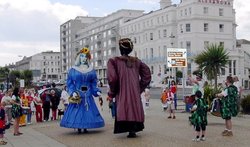 Eastbourne, E. Sussex, mummers on the promenade Wallpaper