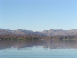 Lake Windermere on an autumn morning, looking towards Bowfell and the Langdale Pikes