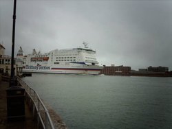 A cross channel ferry sqeezing into the harbour mouth, taken from Spice Island. Wallpaper