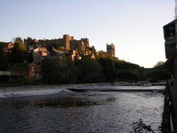 The low autumn sun lights up Durham Castle and Cathedral. Viewed from Framwellgate Waterside. Wallpaper