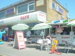 Food stalls and Arcades near the Bell Inn on a summers afternoon, Ingoldmells. Wallpaper