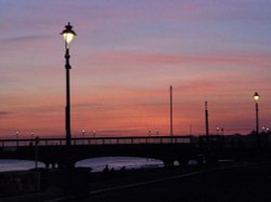 'Sunset' - A view of part of Bournemouth pier at dusk. Wallpaper